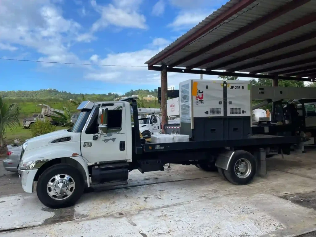 Camión entregando un generador eléctrico de JRH Power Generator